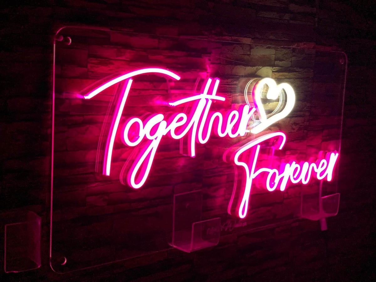 Neon lights sign mounted on bedroom wall